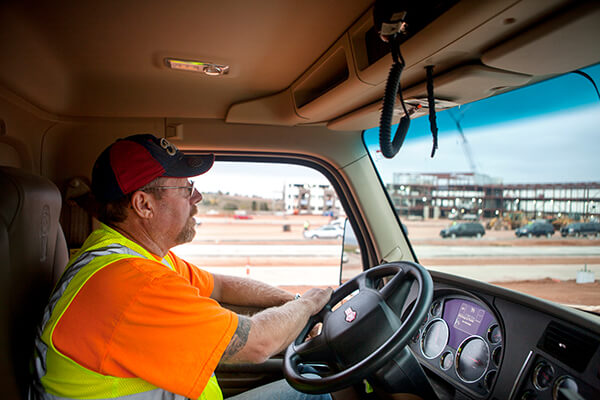 Photo of Kieffer Sanitation worker driving a truck.