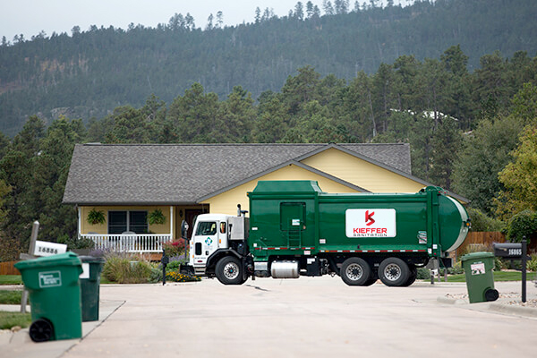 Photo of Kieffer Sanitation truck safely operating in residential area.
